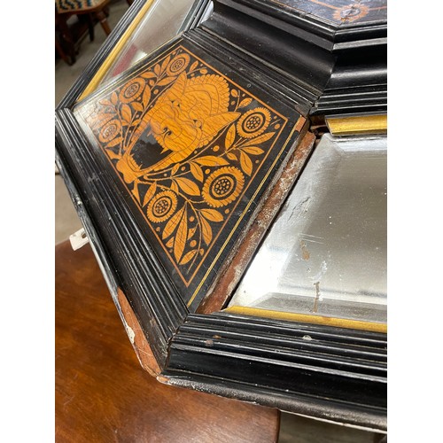 106 - A large Victorian ebonised and marquetry inlaid framed octagonal mirror