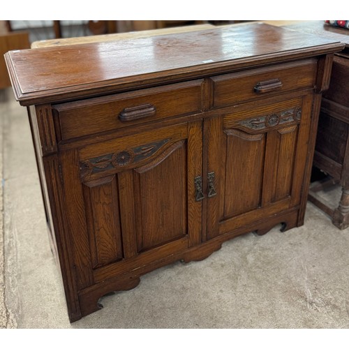 181 - An Edward VII carved oak sideboard