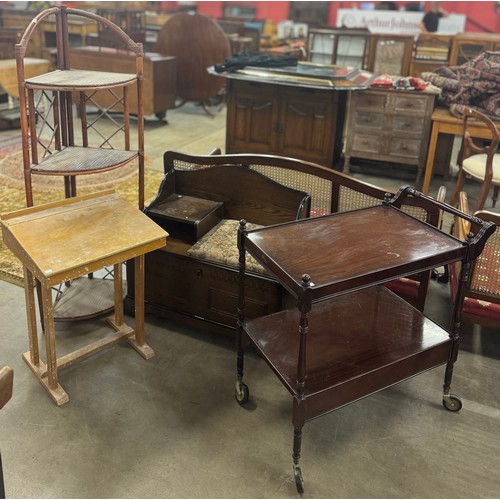 196 - A bamboo corner whatnot, a mahogany tea trolley, a pine school desk and an oak telephone seat