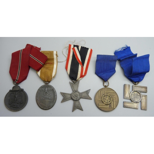 2039 - A collection of five German WWII medallions, West Wall medal, two SS Long Service Awards including 8... 