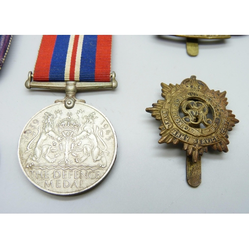 2074 - A WWI Victory medal to 89061 Gnr. H.E. Grudglings R.A., two WWII medals and two badges