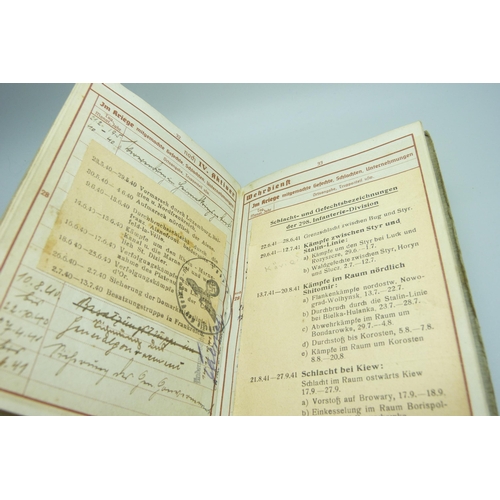 2079 - A German WWII soldiers army handbook, with many entries and stamps throughout the duration of the wa... 