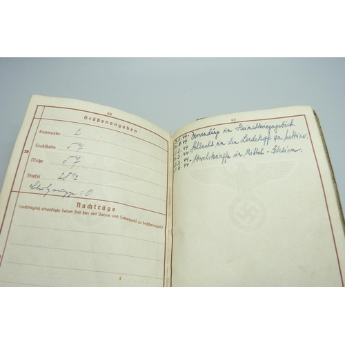 2079 - A German WWII soldiers army handbook, with many entries and stamps throughout the duration of the wa... 