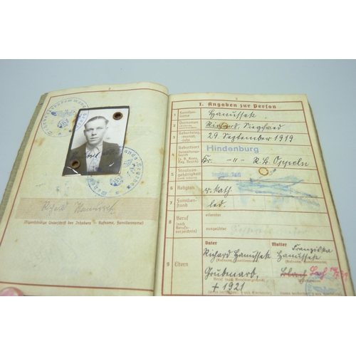 2079 - A German WWII soldiers army handbook, with many entries and stamps throughout the duration of the wa... 