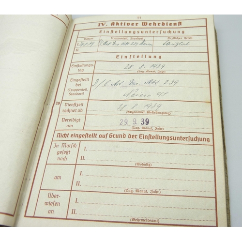 2079 - A German WWII soldiers army handbook, with many entries and stamps throughout the duration of the wa... 