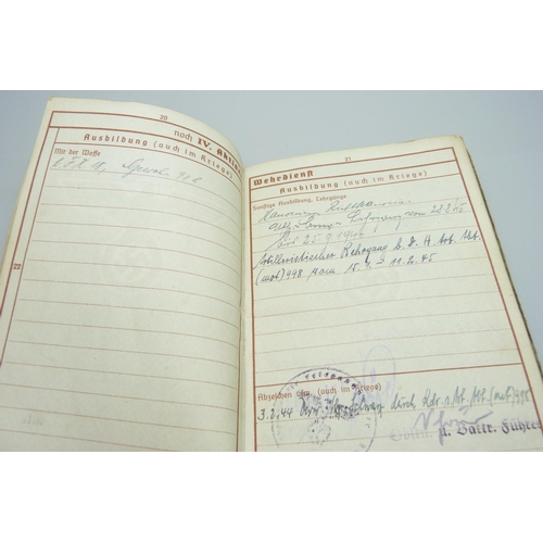 2079 - A German WWII soldiers army handbook, with many entries and stamps throughout the duration of the wa... 