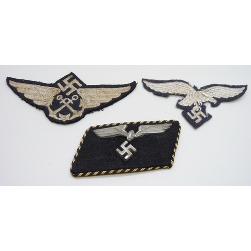 2083 - Three German WWII uniform patches, a German Reich Railway collar tab, a Luftwaffe patch and one othe... 