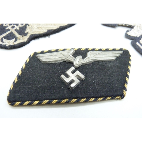 2083 - Three German WWII uniform patches, a German Reich Railway collar tab, a Luftwaffe patch and one othe... 