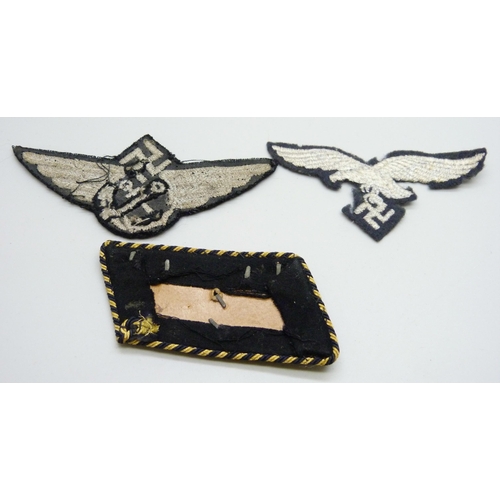 2083 - Three German WWII uniform patches, a German Reich Railway collar tab, a Luftwaffe patch and one othe... 
