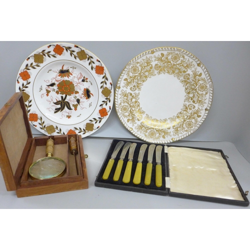 2099 - Two Royal Crown Derby plates, a magnifying glass and letter opener in a wooden box and a cased set o... 