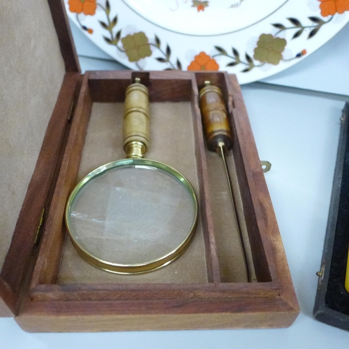 2099 - Two Royal Crown Derby plates, a magnifying glass and letter opener in a wooden box and a cased set o... 