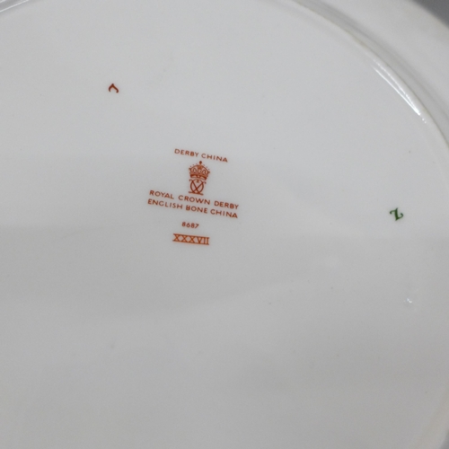 2099 - Two Royal Crown Derby plates, a magnifying glass and letter opener in a wooden box and a cased set o... 