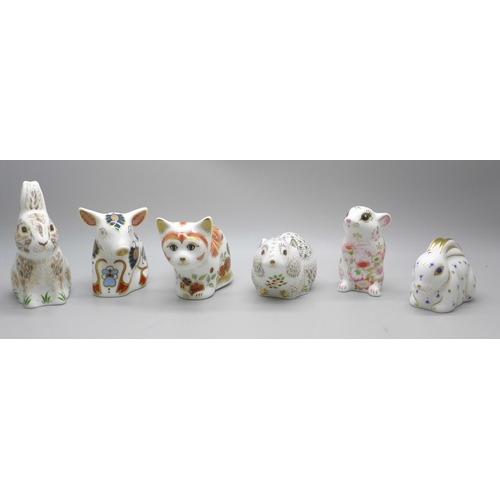 2118 - A collection of six Royal Crown Derby paperweights, including four Collectors Guild, all with gold s... 