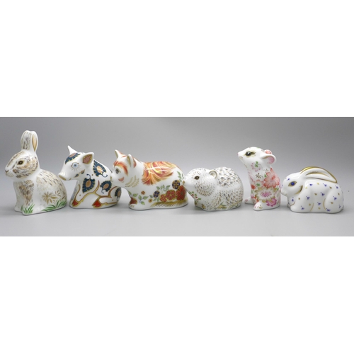 2118 - A collection of six Royal Crown Derby paperweights, including four Collectors Guild, all with gold s... 