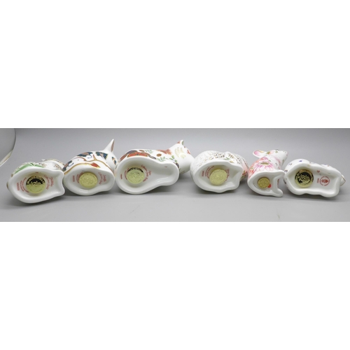 2118 - A collection of six Royal Crown Derby paperweights, including four Collectors Guild, all with gold s... 