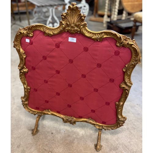 208 - A Roccoco style gilt metal and red fabric fire screen