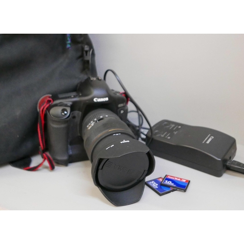 2201 - A Canon EOS-1 D Mark II N professional camera with Sigma, 24-70mm, 1:2.8 ExDG lens, power pack and L... 