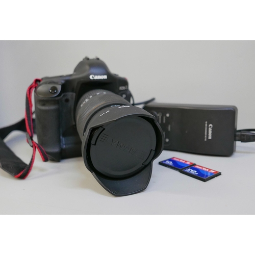 2201 - A Canon EOS-1 D Mark II N professional camera with Sigma, 24-70mm, 1:2.8 ExDG lens, power pack and L... 