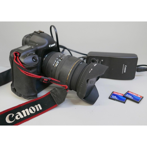 2201 - A Canon EOS-1 D Mark II N professional camera with Sigma, 24-70mm, 1:2.8 ExDG lens, power pack and L... 