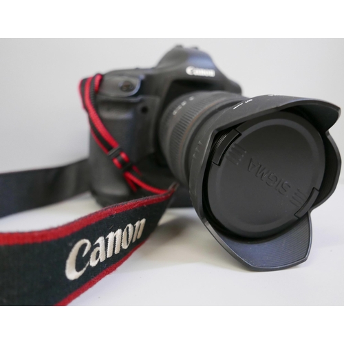 2201 - A Canon EOS-1 D Mark II N professional camera with Sigma, 24-70mm, 1:2.8 ExDG lens, power pack and L... 