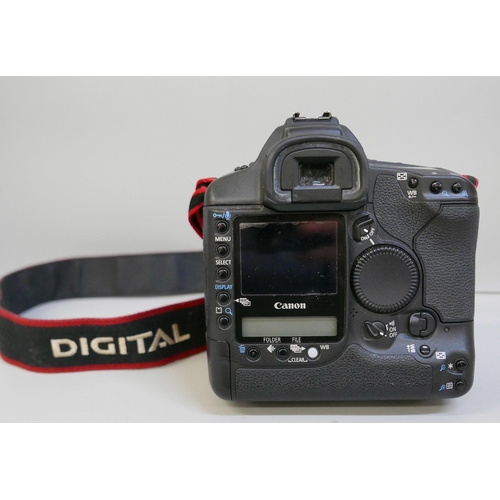 2201 - A Canon EOS-1 D Mark II N professional camera with Sigma, 24-70mm, 1:2.8 ExDG lens, power pack and L... 
