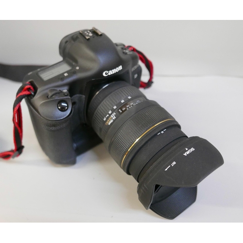 2201 - A Canon EOS-1 D Mark II N professional camera with Sigma, 24-70mm, 1:2.8 ExDG lens, power pack and L... 