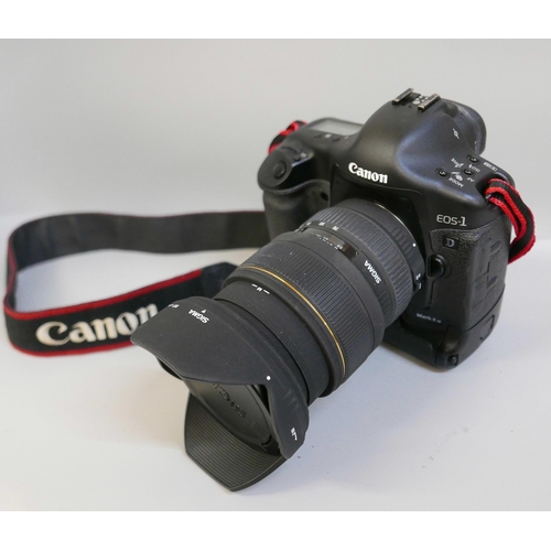 2201 - A Canon EOS-1 D Mark II N professional camera with Sigma, 24-70mm, 1:2.8 ExDG lens, power pack and L... 