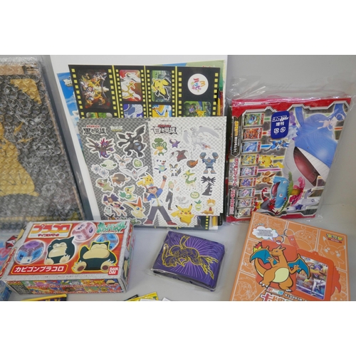 2242 - Pokémon stickers, vintage, including McDonalds, a Pocket Monsters Jumbo card, a Chinese Charizard se... 