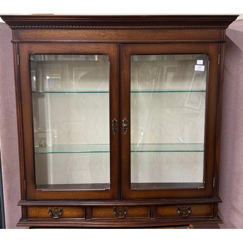 209 - A Regency style mahogany wall hanging display cabinet