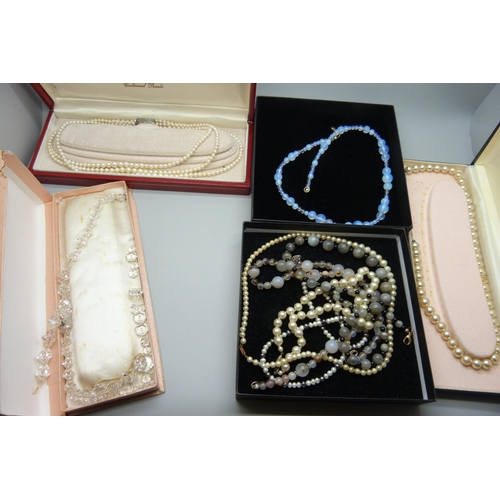 2283 - A collection of bead necklaces including moonstone, faux pearls and a three strand cultured pearl ne... 