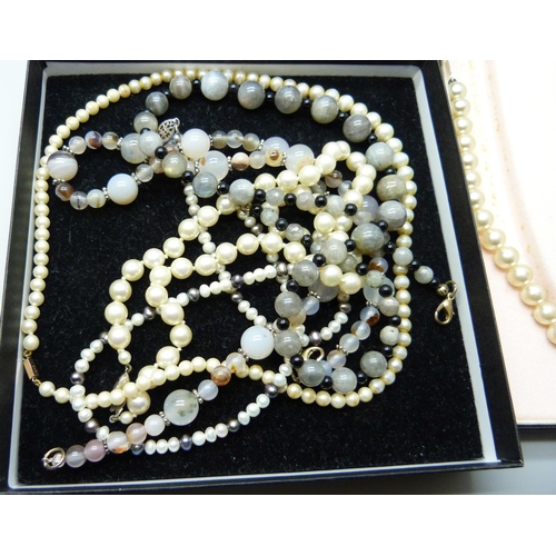 2283 - A collection of bead necklaces including moonstone, faux pearls and a three strand cultured pearl ne... 