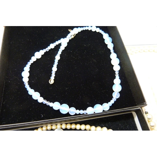 2283 - A collection of bead necklaces including moonstone, faux pearls and a three strand cultured pearl ne... 