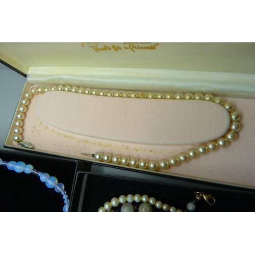 2283 - A collection of bead necklaces including moonstone, faux pearls and a three strand cultured pearl ne... 