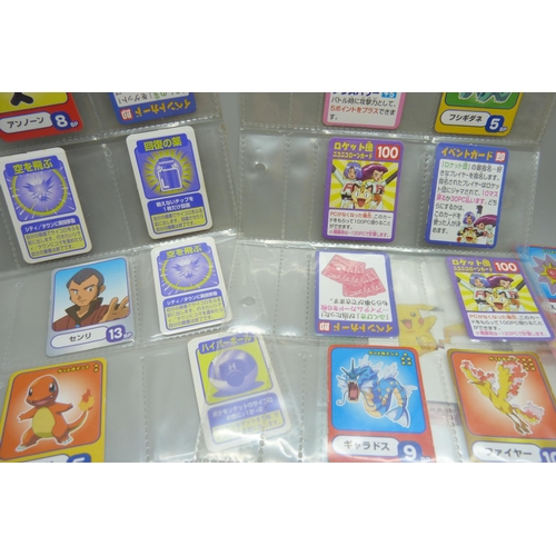 2292 - A collection of Pokémon playing cards, vintage, Pokémon board game cards, Pokémon stickers, Japanese... 