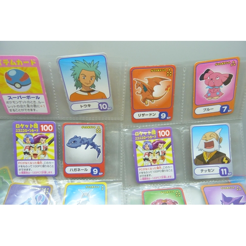 2292 - A collection of Pokémon playing cards, vintage, Pokémon board game cards, Pokémon stickers, Japanese... 