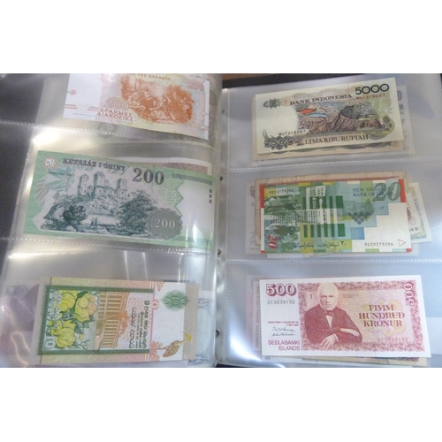 2294 - A collection of British and worldwide banknotes and a Penny black commemorative 50p coin