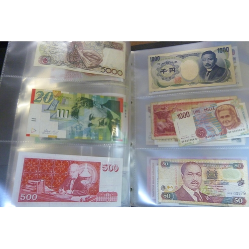 2294 - A collection of British and worldwide banknotes and a Penny black commemorative 50p coin