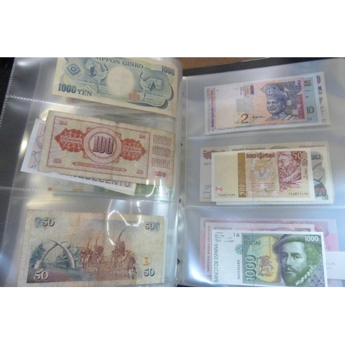 2294 - A collection of British and worldwide banknotes and a Penny black commemorative 50p coin