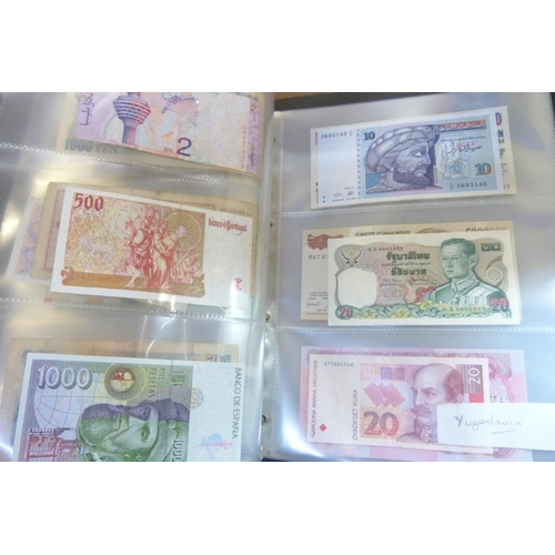 2294 - A collection of British and worldwide banknotes and a Penny black commemorative 50p coin