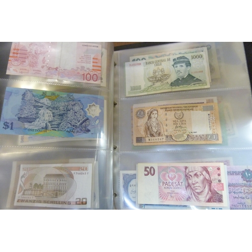 2294 - A collection of British and worldwide banknotes and a Penny black commemorative 50p coin