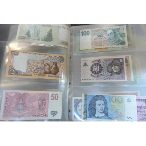 2294 - A collection of British and worldwide banknotes and a Penny black commemorative 50p coin