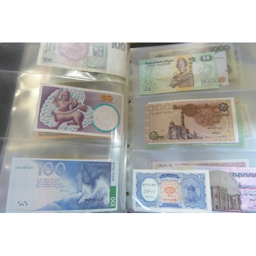 2294 - A collection of British and worldwide banknotes and a Penny black commemorative 50p coin