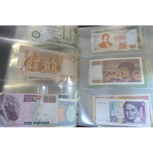 2294 - A collection of British and worldwide banknotes and a Penny black commemorative 50p coin