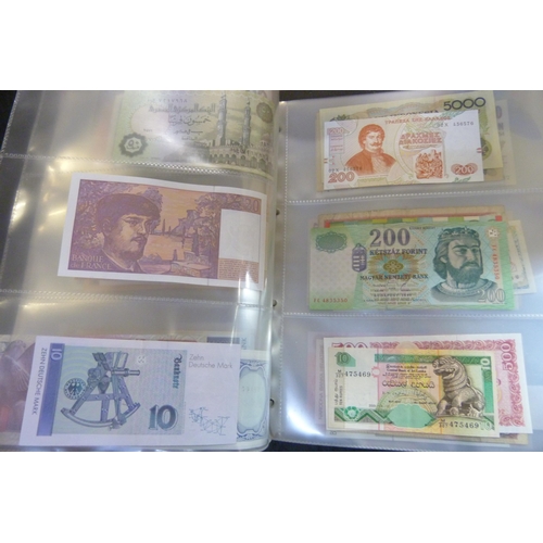 2294 - A collection of British and worldwide banknotes and a Penny black commemorative 50p coin