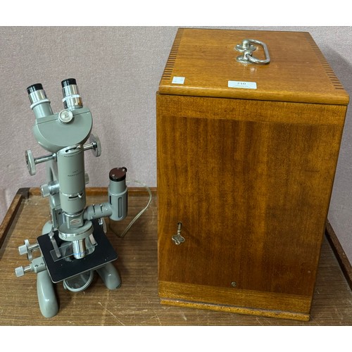 210 - A cased Beck microscope, specimen slides, etc.