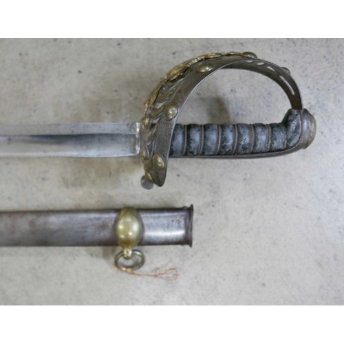 2089 - A 19th Century 1834 pattern 1st Life Guards sword with scabbard, detail on blade worn, 4cm spit on t... 
