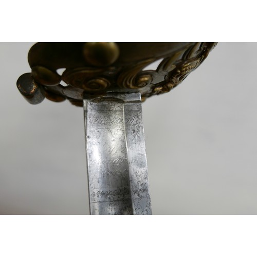 2089 - A 19th Century 1834 pattern 1st Life Guards sword with scabbard, detail on blade worn, 4cm spit on t... 