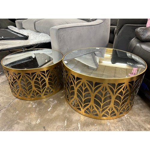 3105 - A pair of gilt leaf circular coffee tables with mirrored tops