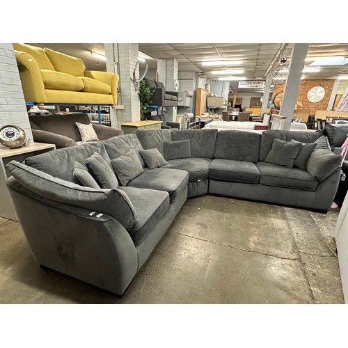 3107 - A steel velvet upholstered corner sofa