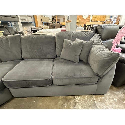 3107 - A steel velvet upholstered corner sofa